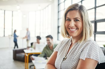 woman smiling in a modern office